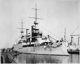 330px-Kearsarge_(BB5),_converted_to_craneship_in_1920._Port_bow,_at_wharf,_09-18-1899_-_NARA_-_535431